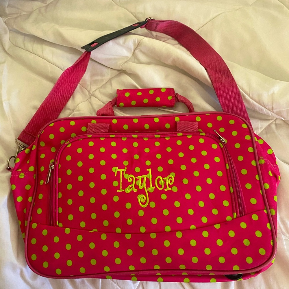 Monogrammed bag with “Taylor” for girl in pink background with neon green dots.